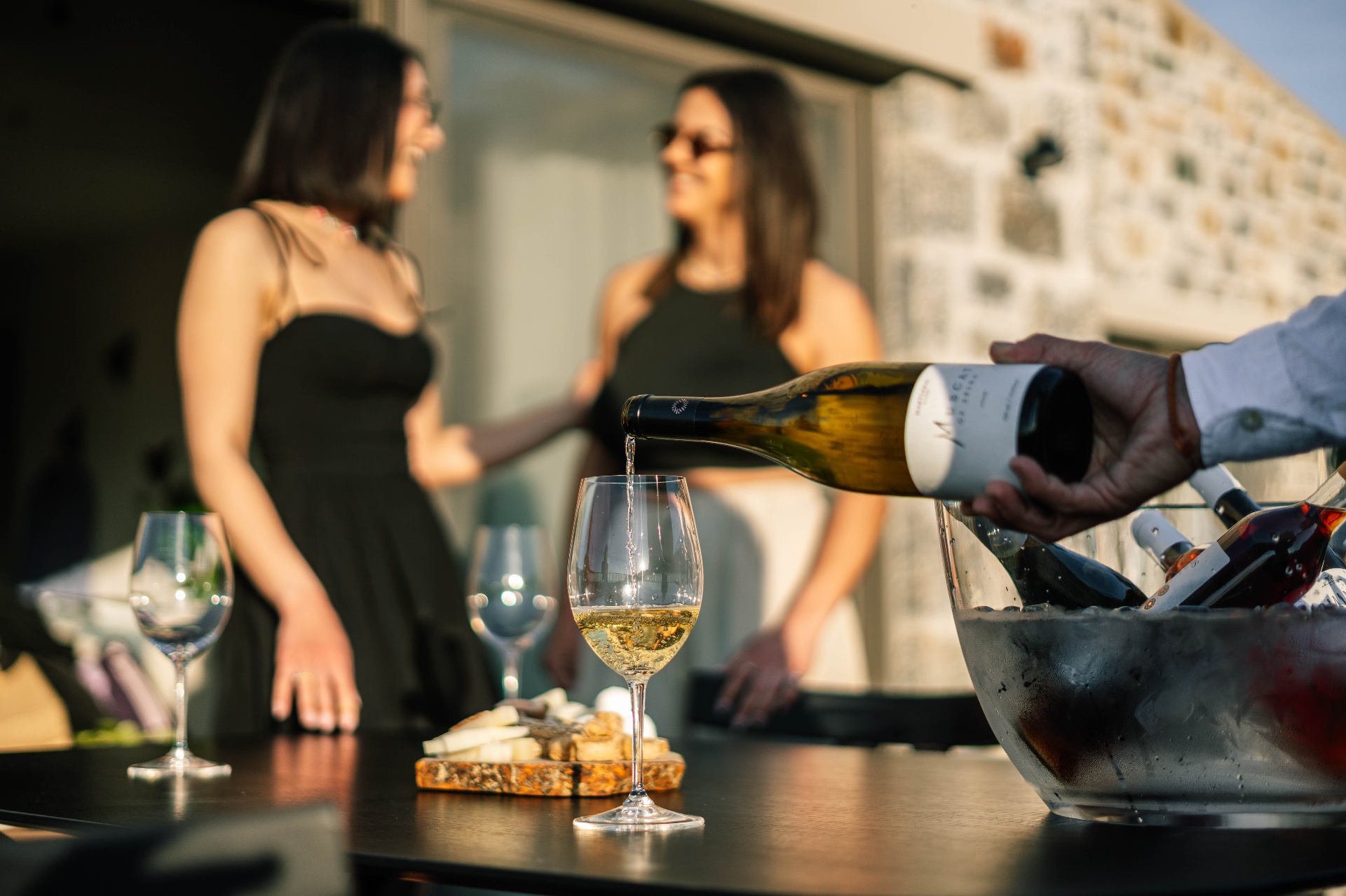 Pouring Cretan white wine at golden hour